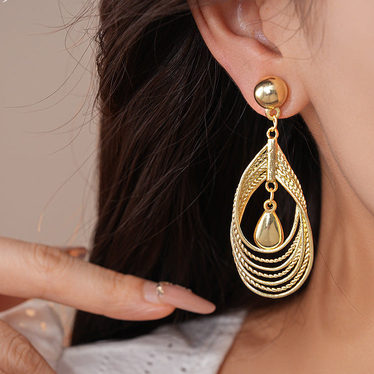 Multi-layered teardrop-shaped hollow earrings