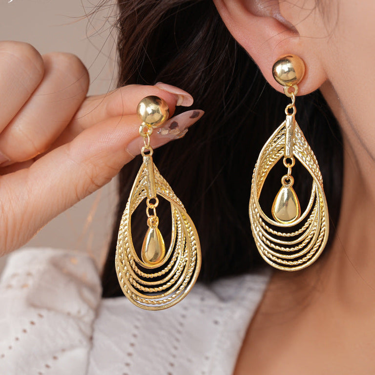 Multi-layered teardrop-shaped hollow earrings