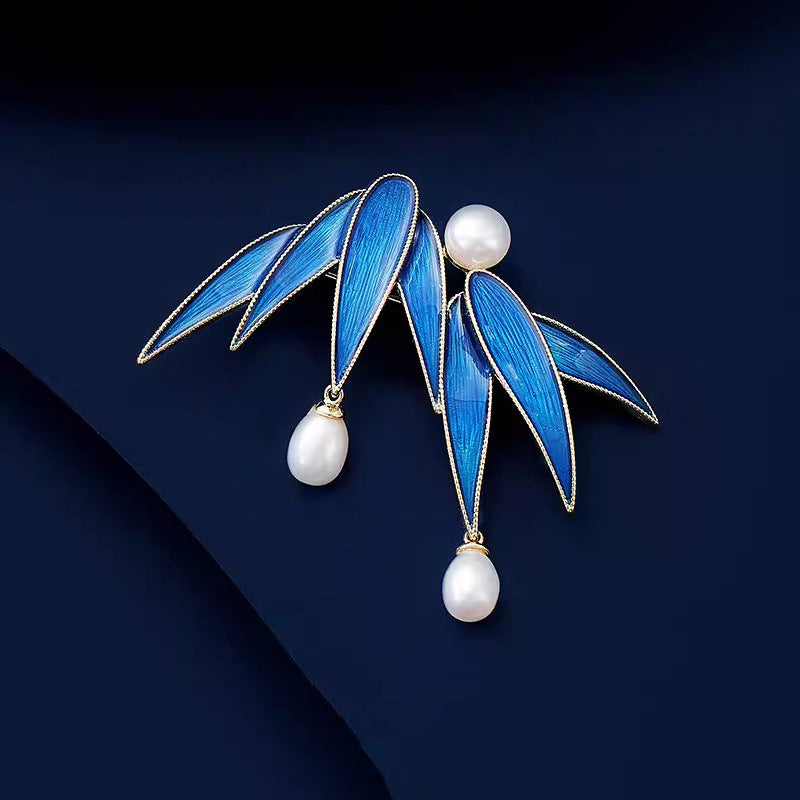 Broche te t-xaq bambú te perla