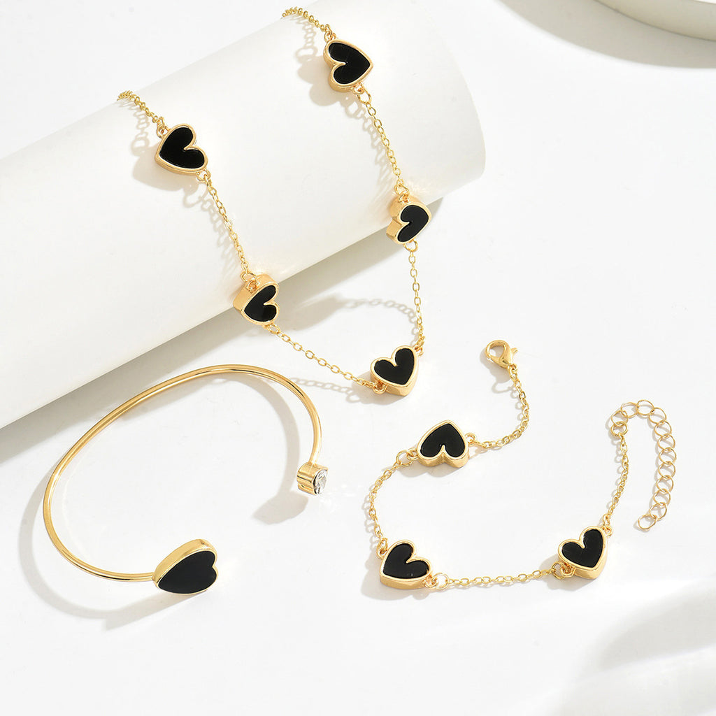 Heart-shaped necklace and adjustable bracelet set.