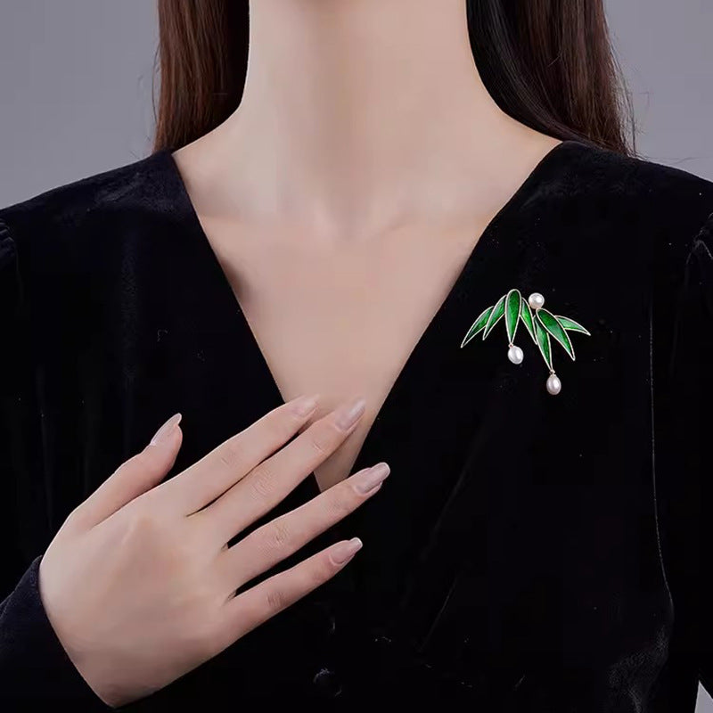 Broche te t-xaq bambú te perla