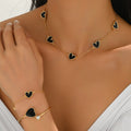 Heart-shaped necklace and adjustable bracelet set.