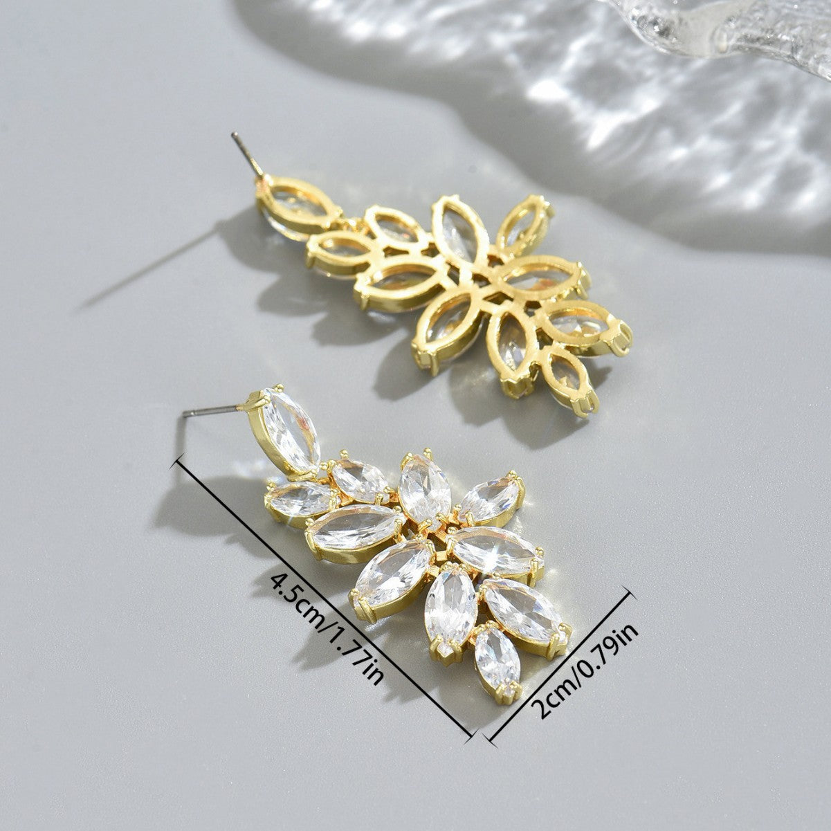 Chanel-style women's earrings encrusted with diamonds