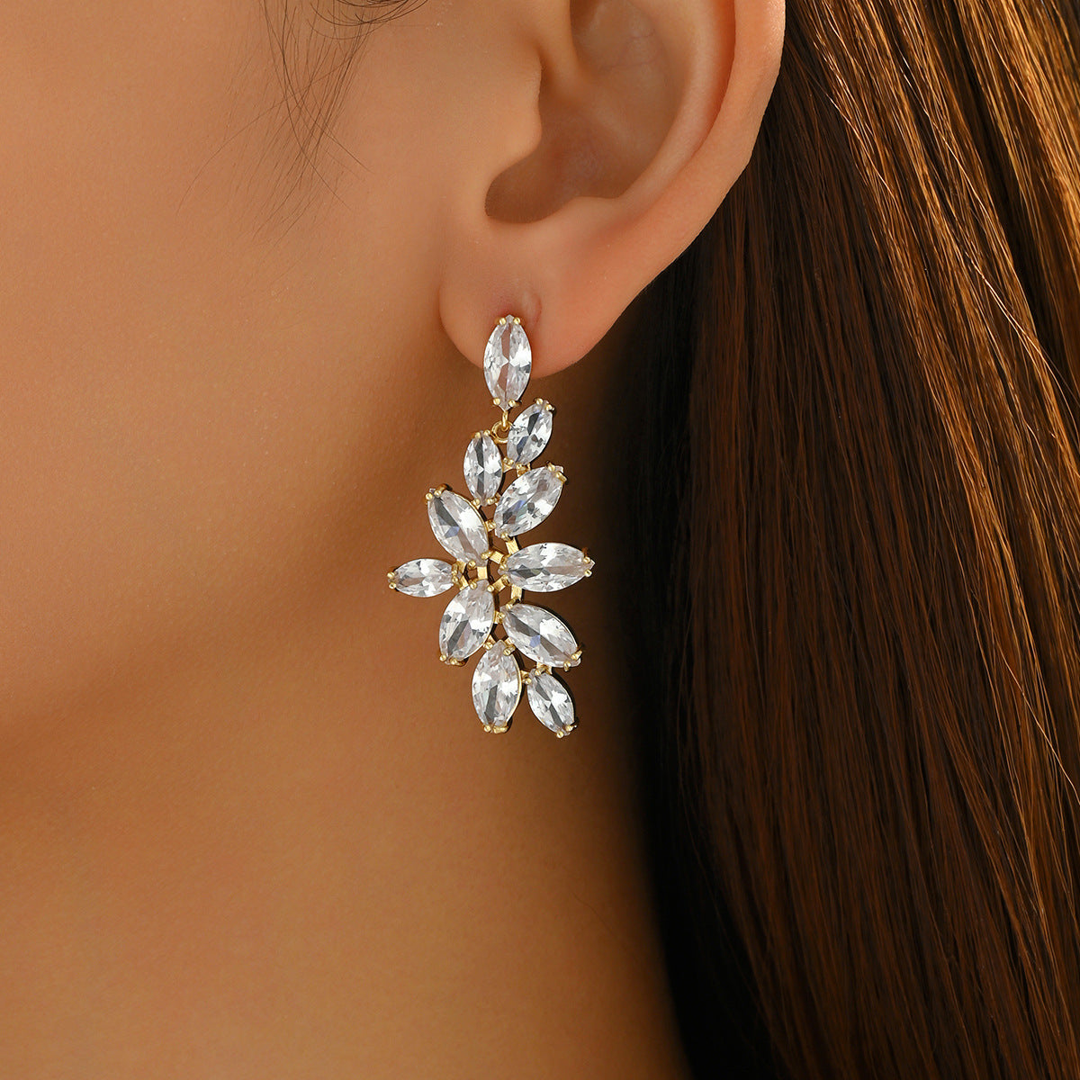 Chanel-style women's earrings encrusted with diamonds