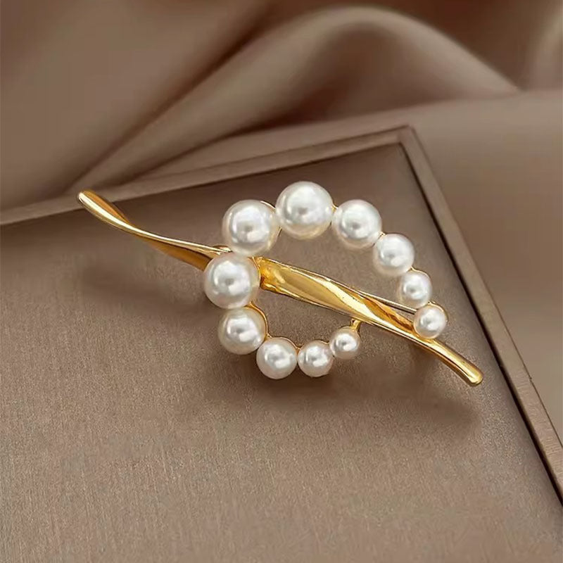 Broche de notas musicales de perla