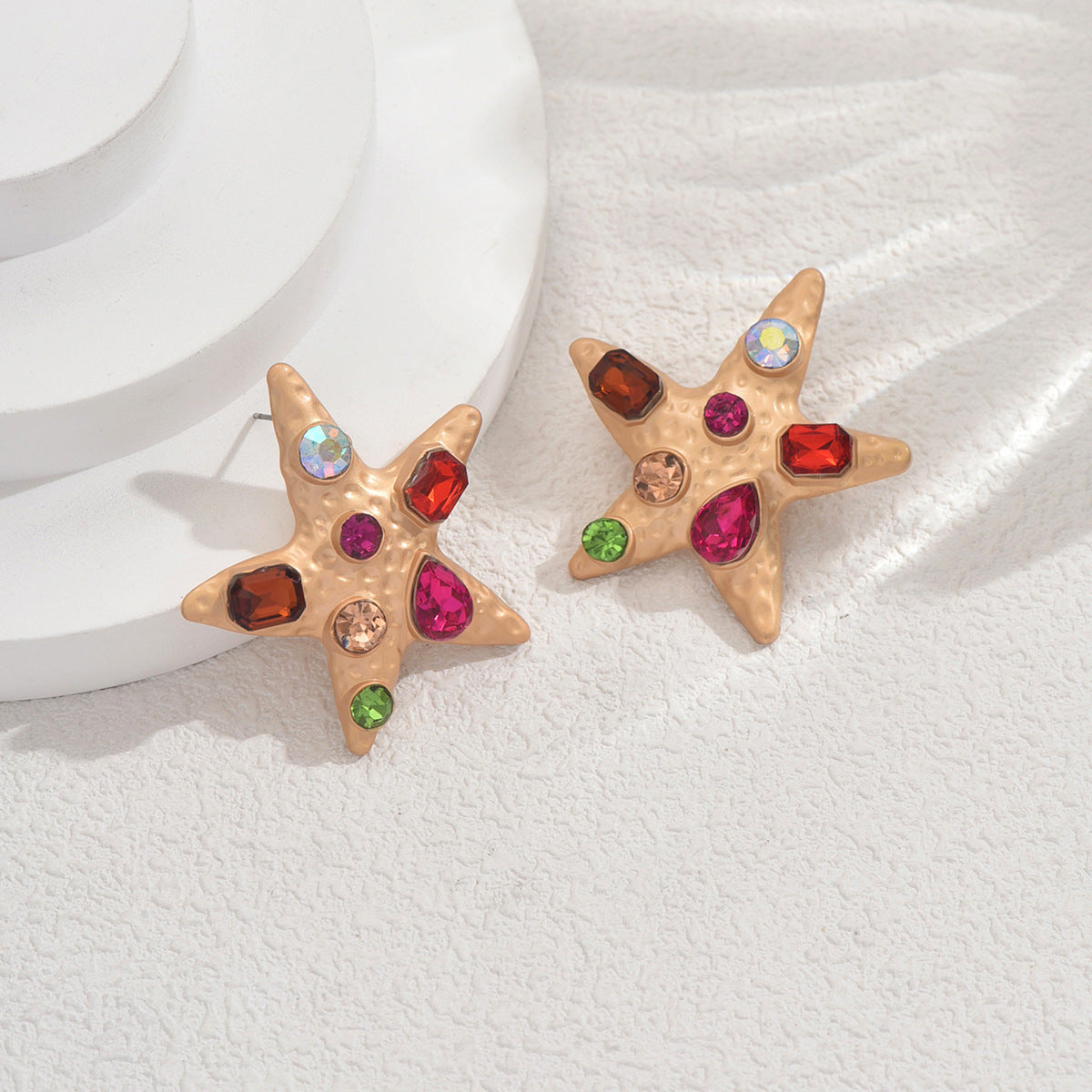 Star-shaped colored diamond earrings