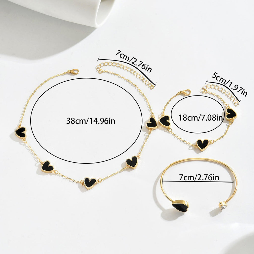 Heart-shaped necklace and adjustable bracelet set.