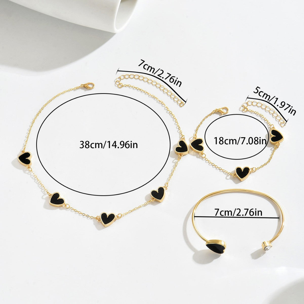 Heart-shaped necklace and adjustable bracelet set.
