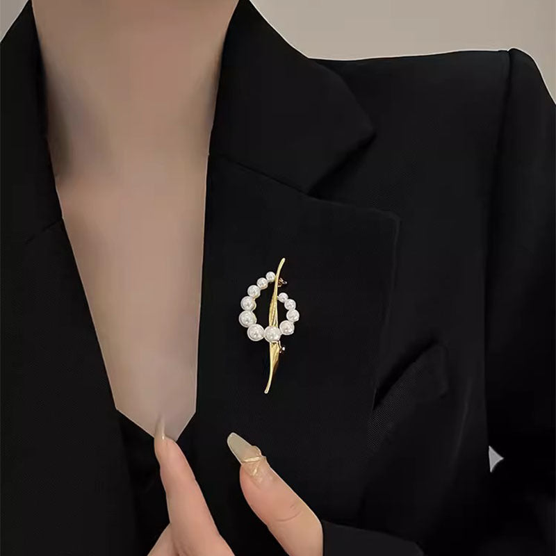 Broche de notas musicales de perla