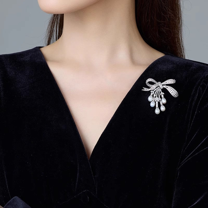 Broche de borla de arco