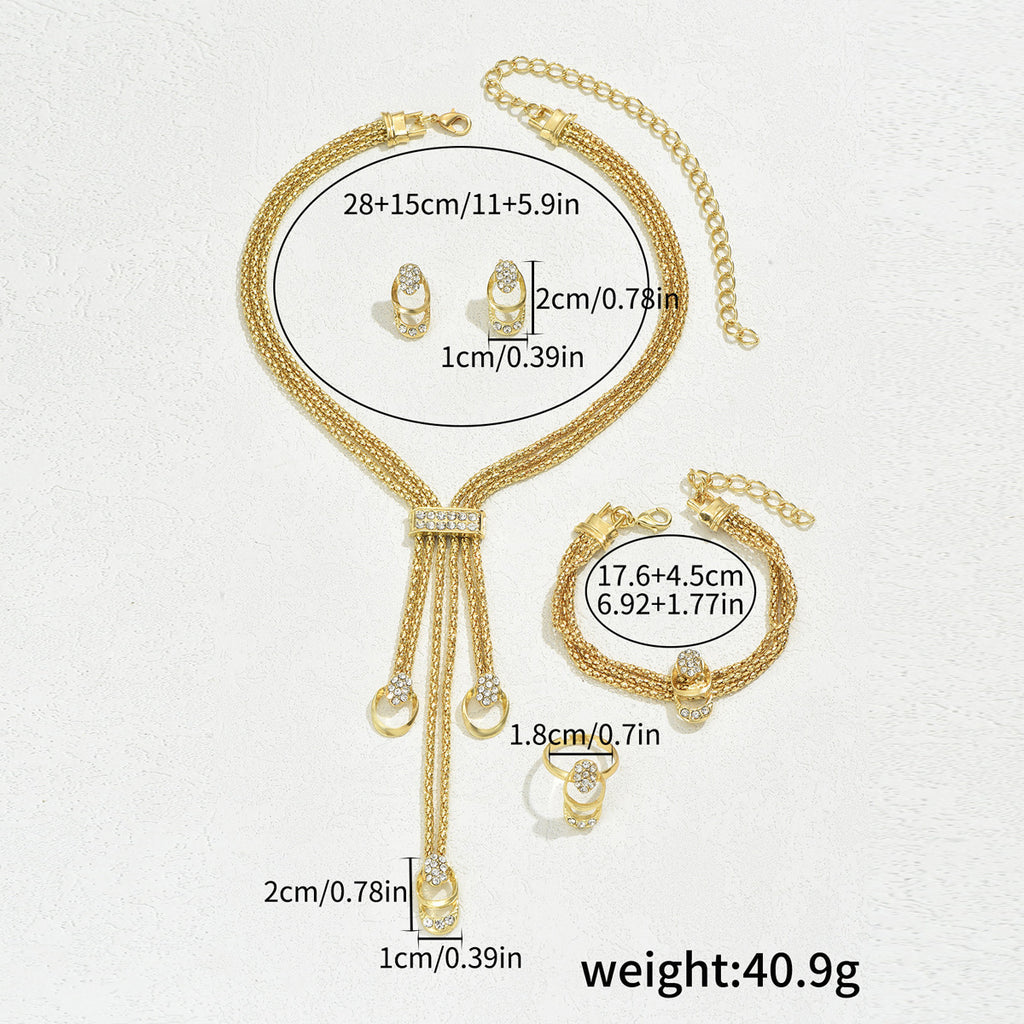 Necklace, earrings, and diamond-encrusted clavicle chain set