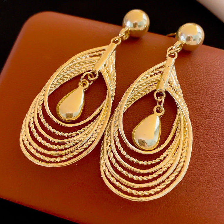 Multi-layered teardrop-shaped hollow earrings
