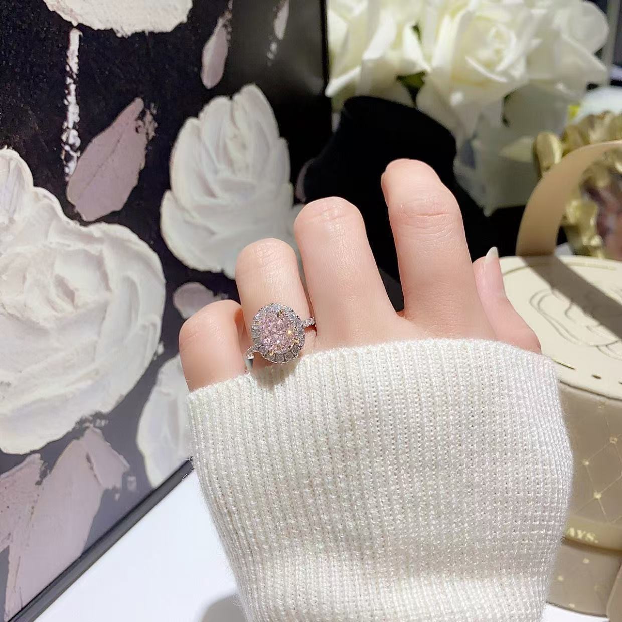 Pink diamond pigeon egg oval ring