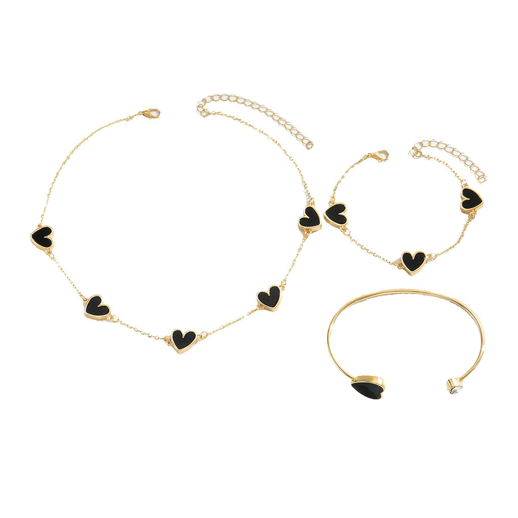Heart-shaped necklace and adjustable bracelet set.